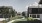 a row of houses with green paths