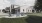 a house with a lawn and chairs