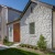 a luxury rental home with green paths