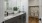 bathroom with a large mirror and walk-in shower