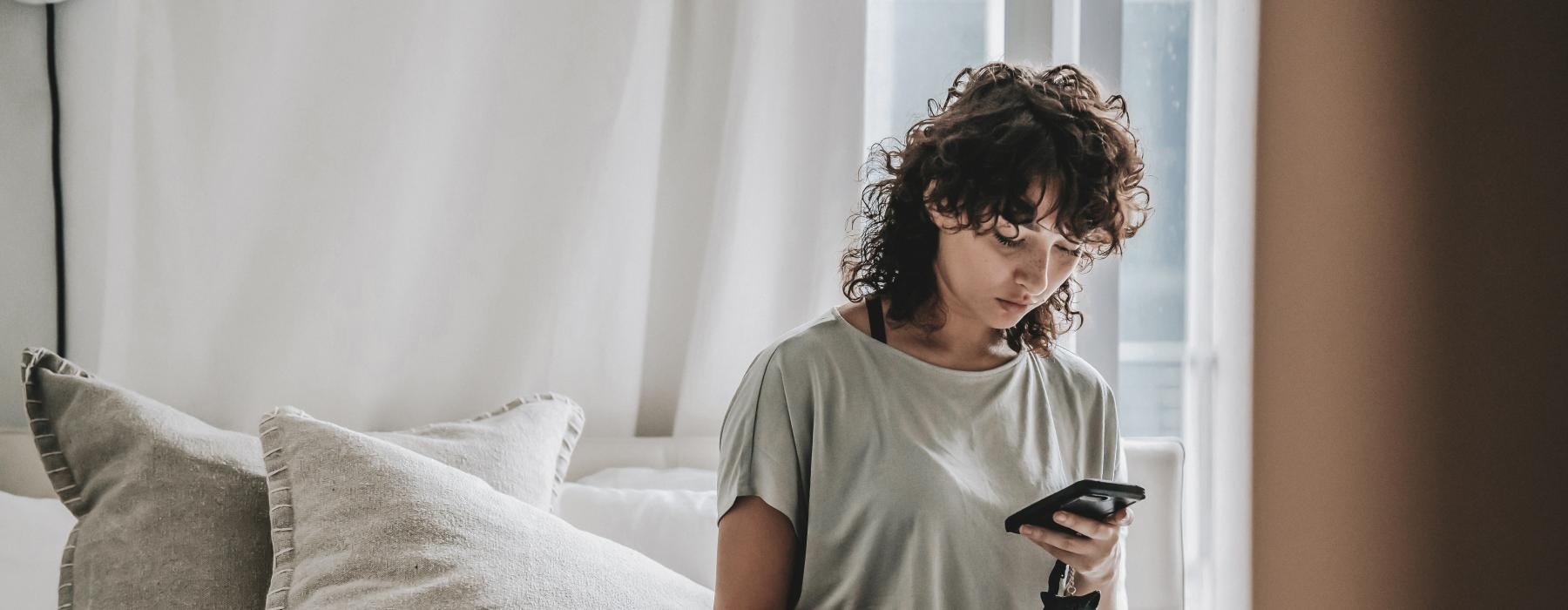 a person sitting on a bed