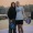 a couple posing on a pickleball court